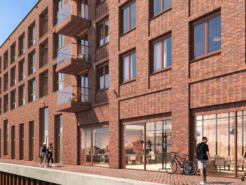 Het bouwteam viert het hoogste punt